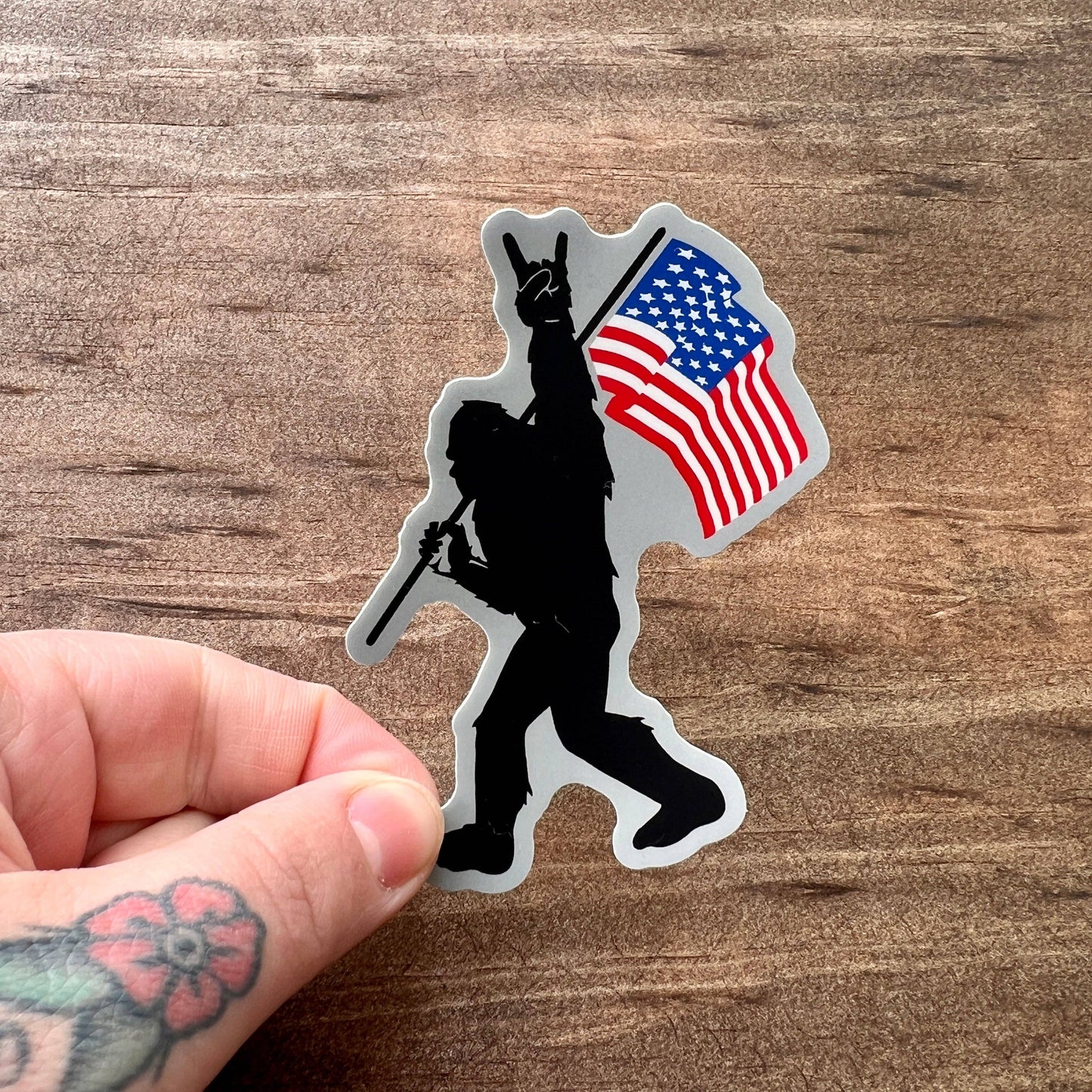 Bigfoot Carrying Flag Sticker 142